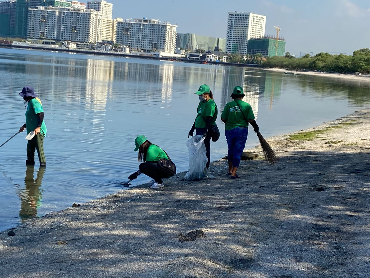 A coastal cleanup amidst calm waters and a progressive urban layer (Las Piñas Wetland Park Coastal Cleanup, March 8, 2022)