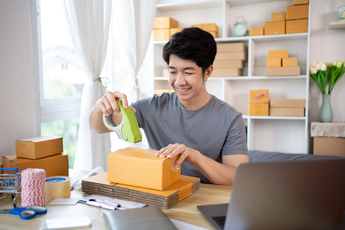 a man sealing his parcel